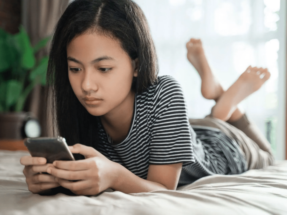 teenage girl on her phone